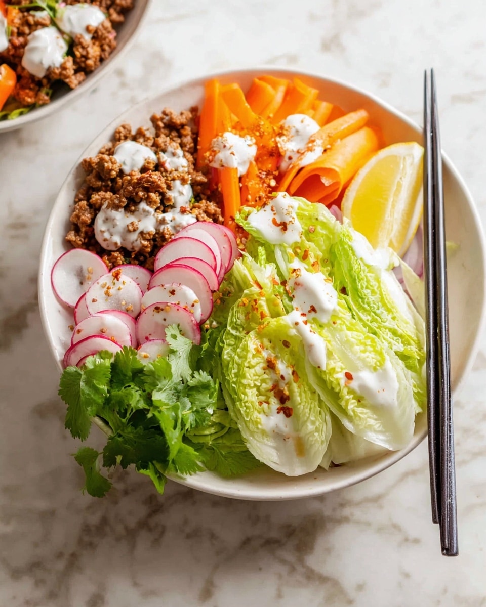 The image shows a white bowl filled with several layers of fresh ingredients arranged in sections. Starting from the top left, there is a layer of cooked minced meat in a brown color, topped with white sauce dots. Next to it, bright orange carrot slices add a pop of color, also drizzled with white sauce. Alongside, there is a wedge of light yellow lemon, followed by crisp pale green wedges of lettuce sprinkled with red seasoning and white sauce. Red onion slices and fresh radishes with green stems are on the bottom left, adding texture and color contrasts. A small bunch of green cilantro leaves sits near the lettuce. Black chopsticks rest on the bowl’s edge over a white marbled surface background, adding an elegant touch. photo taken with an iphone --ar 4:5 --v 7
