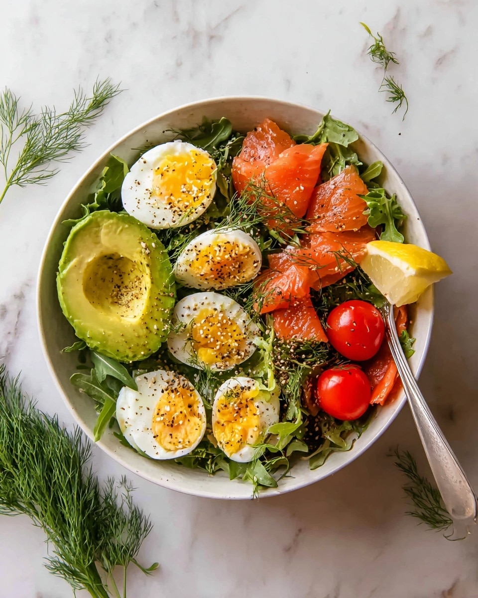 A white bowl filled with a fresh salad sits on a white marbled surface. At the bottom, there is a layer of dark green leafy arugula and herbs. On top of the leaves, soft orange slices of smoked salmon are placed around the bowl. One half of a sliced avocado with bright green, smooth, and creamy texture is on the left side. Four halved boiled eggs with yellow yolks and white edges are scattered across the bowl, sprinkled with black pepper and sesame seeds. Five small, shiny, red cherry tomatoes form a cluster near the center. A lemon wedge with bright yellow juicy flesh is placed near the top right, next to a silver fork resting inside the bowl. Fresh dill sprigs are scattered over the entire salad for garnish. Photo taken with an iphone --ar 4:5 --v 7