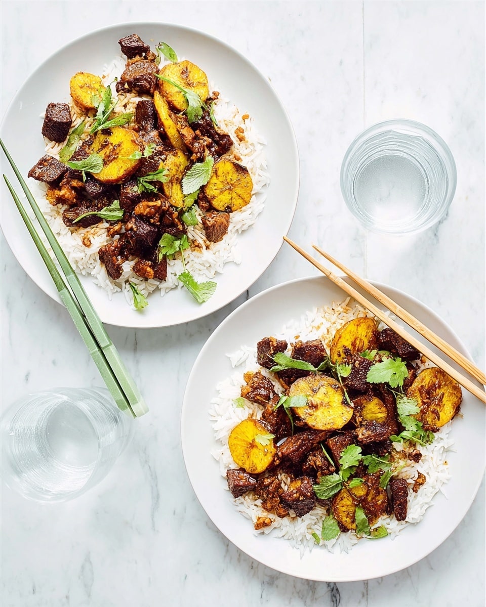 Two white plates sit on a white marbled surface, each holding a serving of white rice as the base layer. On top of the rice, there is a mix of dark brown stir-fried pieces, likely meat, and golden yellow chunks of fried plantains. Green herbs are scattered on top of the dish, adding a fresh touch. One plate has a pair of green chopsticks resting across it, while the other has a pair of light tan chopsticks placed on the right side. Between the plates, there is a clear glass filled with water. photo taken with an iphone --ar 4:5 --v 7