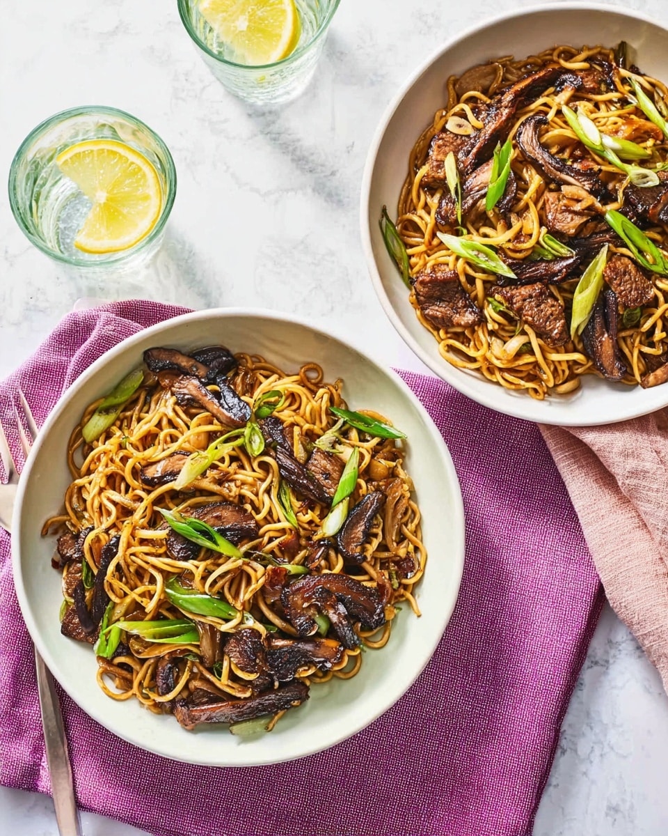 Two white bowls filled with stir-fried noodles, slices of grilled mushrooms, pieces of cooked meat, and green onion chunks. The noodles are golden-brown and mixed with the dark brown grilled mushrooms and meat, creating a textured, savory look. Bright green spring onion pieces are scattered on top, adding a fresh color contrast. One bowl rests on a purple cloth napkin, and both sit on a white marbled surface next to glasses filled with water and lemon slices. A folded pink cloth napkin is placed between the bowls. Photo taken with an iphone --ar 4:5 --v 7