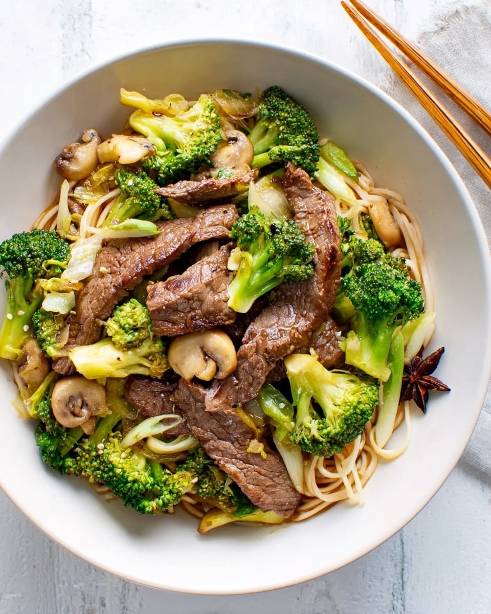 A white bowl filled with thin cooked noodles on the bottom layer, topped with bright green broccoli pieces and light green vegetable slices. On top of these, there are several medium-brown cooked strips of beef with a slight shine. There are also small light brown mushrooms scattered throughout the dish, with a dark brown star-shaped spice visible near the side. The bowl is placed on a white marbled surface with wooden chopsticks resting at the top. photo taken with an iphone --ar 4:5 --v 7