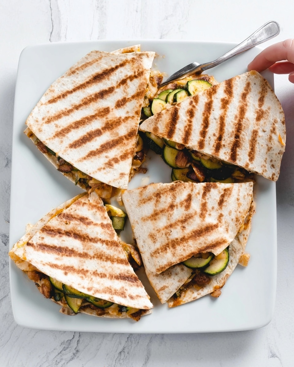 The image shows a white square plate on a white marbled surface holding four grilled quesadilla wedges, each with visible grill marks on the slightly browned tortilla outer layer. Each wedge is filled with a colorful mix of sliced green zucchini, melted cheese, and bits of light brown beans or nuts, with the fillings peeking out between the folded tortilla layers. The textures vary from the soft melted cheese to the tender zucchini and firmer beans. A metal fork rests on the top edge of the plate, and a woman's hand is reaching towards one of the quesadilla wedges in the top right corner. Photo taken with an iphone --ar 4:5 --v 7