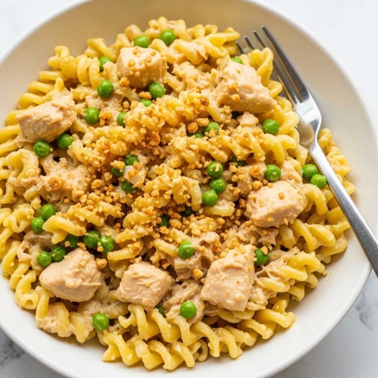 Creamy Tuna Noodle Casserole with Cheddar, Peas, and Crispy Ritz Topping Recipe